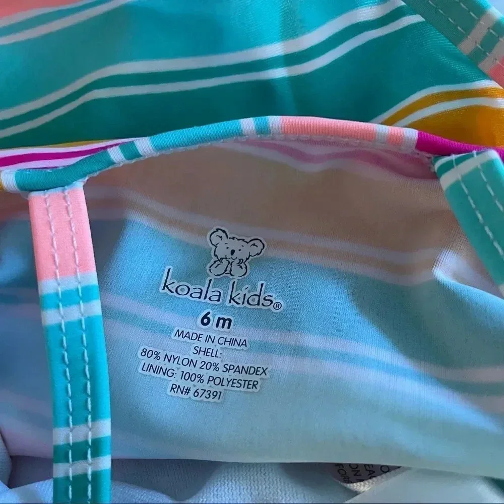 Koala Kids multi color bathing suit w/ “Born Chic” wording